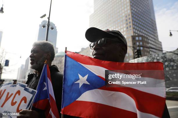 Puerto Rican activists and others participate in a protest outside of New York City's Federal Emergency Management Agency office to call on Congress...