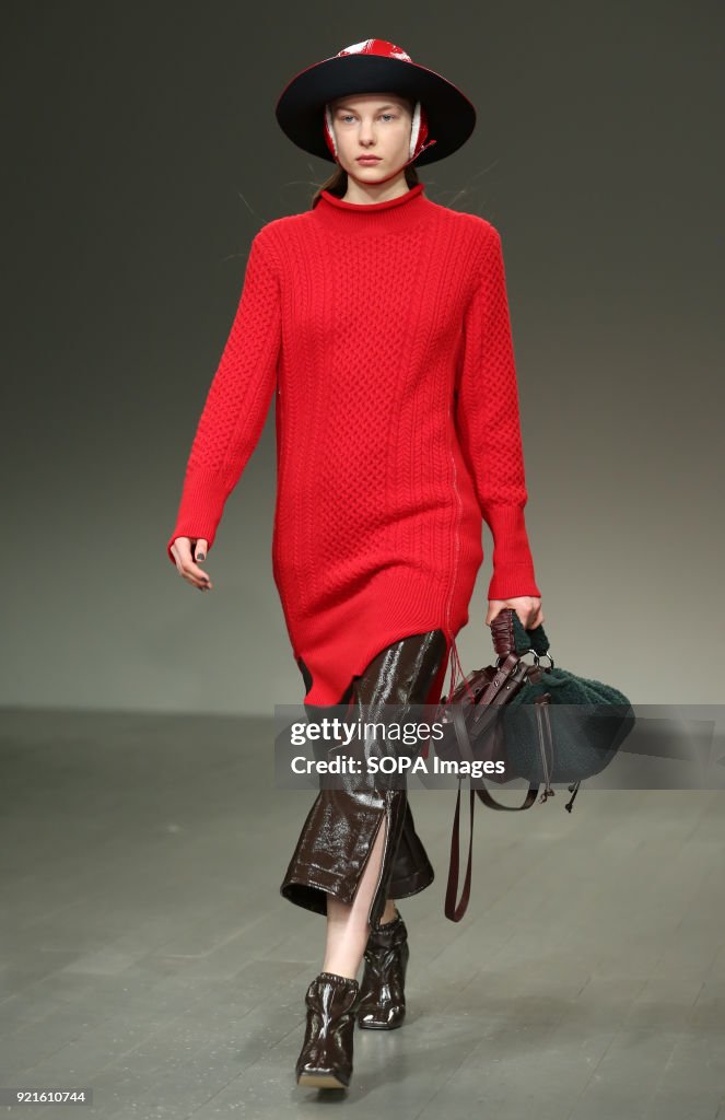 A model walk the runway at the Eudon Choi Show during London...