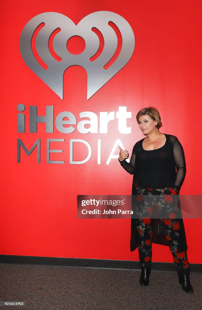 Celebrities Visit The Enrique Santos Show At I Heart Latino Studio