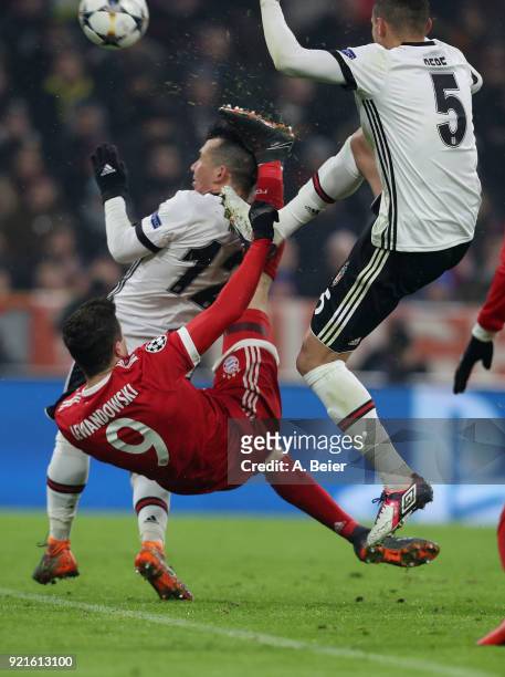 Robert Lewandowski of FC Bayern Muenchen hits Gary Medel of Besiktas JK with his foot during the UEFA Champions League Round of 16 first leg match...