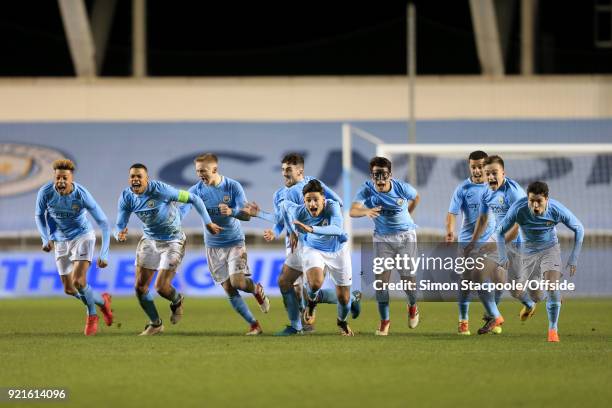 Man City players celebrate victory following a penalty shootout at the end of the UEFA Youth League Round of 16 match between Manchester City and...