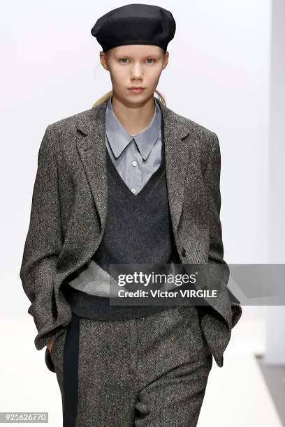 Model walks the runway at the Margaret Howell Ready to Wear Fall/Winter 2018-2019 fashion show during London Fashion Week February 2018 on February...