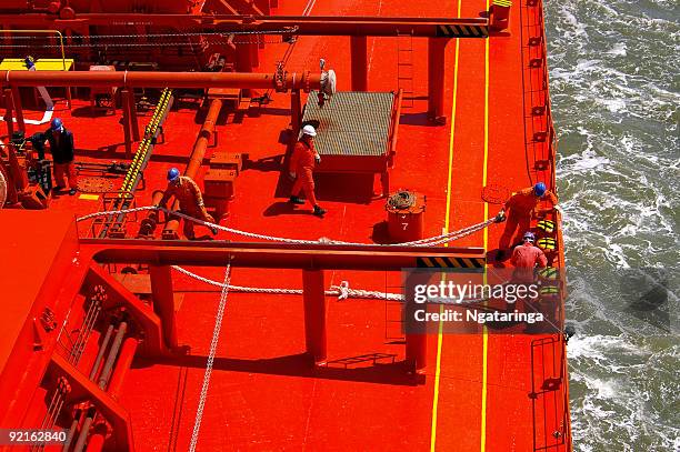 preparing to moor - ship crew stock pictures, royalty-free photos & images