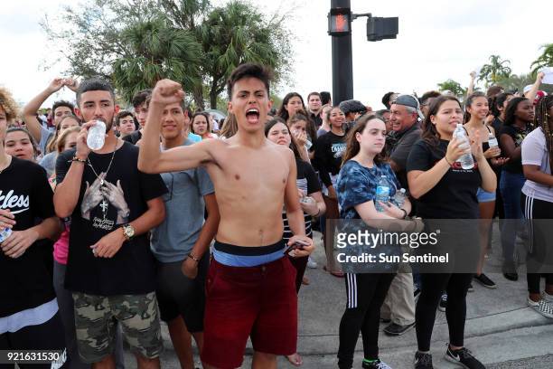 West Boca Raton Community High School students cheer after reaching Marjory Stoneman Douglas High School in Parkland, Fla. On Tuesday, Feb. 20, 2018.