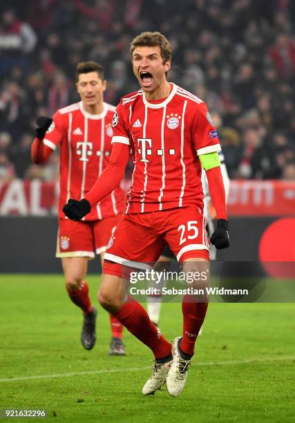 Thomas Mueller of Bayern Muenchen celebrates after scoring his sides third goal during the UEFA Champions League Round of 16 First Leg match between...