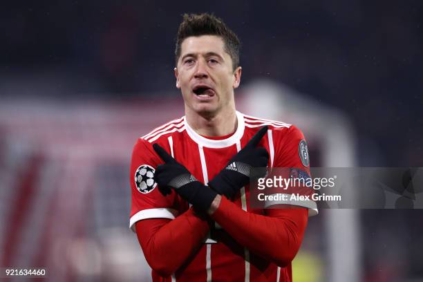 Robert Lewandowski of Bayern Muenchen celebrates after scoring his sides fourth goal during the UEFA Champions League Round of 16 First Leg match...