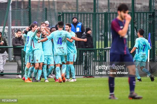Barcelona celebrate after Carles Perez of Barcelona scores the only goal of the game during the UEFA Youth League match between Paris Saint Germain...