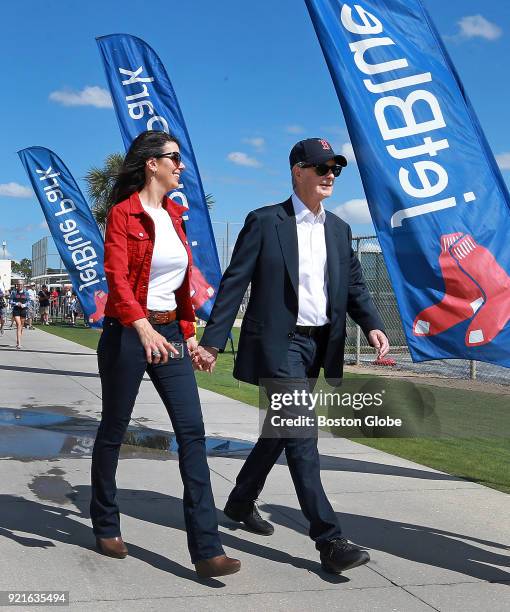 Boston Red Sox principal owner John Henry, right, and his wife Linda Pizzuti Henry walk the grounds on the day of the first full squad spring...