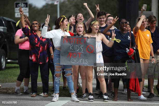 Some of the hundreds of West Boca High School students arrive at Marjory Stoneman Douglas High School after they walked there in honor of the 17...