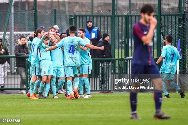 Barcelona celebrate after Carles Perez of Barcelona scores the only goal of the game during the UEFA Youth League match between Paris Saint Germain...