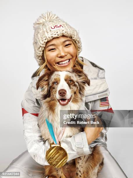 Portrait of USA Chloe Kim posing with her Australian shepherd dog Reese and gold medal during photo shoot at Los Coyotes Country Club. Kim won gold...