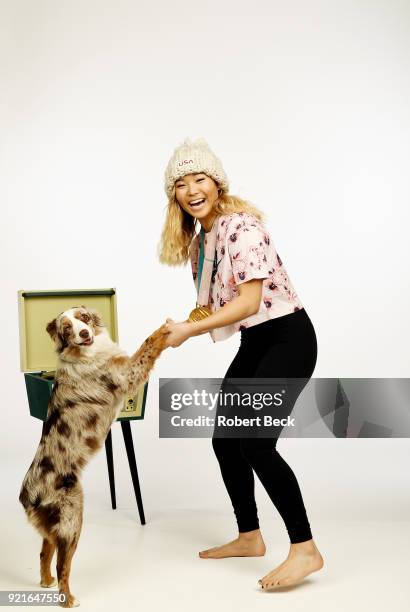 Portrait of USA Chloe Kim posing with her Australian shepherd dog Reese and gold medal during photo shoot at Los Coyotes Country Club. Kim won gold...