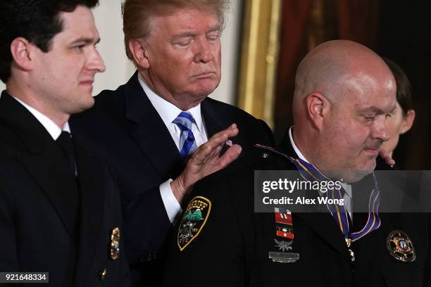 The medal falls down as U.S. President Donald Trump presents the Public Safety Medal of Valor to Sergeant William Buchanan of Avery County Sheriff's...