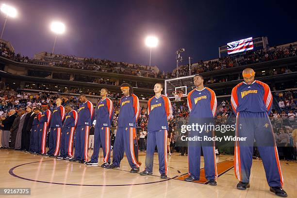 The Golden State Warriors stand for the national anthem prior to the preseason game against the Phoenix Suns at Indian Wells Tennis Garden on October...