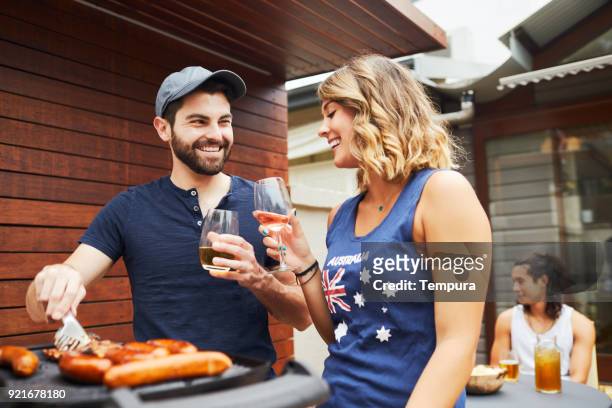 friends in a barbecue - bbq australia stock pictures, royalty-free photos & images