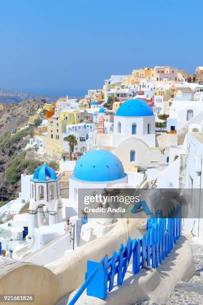 Greece, Cyclades, Santorini Island : traditional whitewashed houses with colourful facades in the village of Oia.