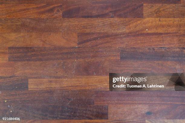 dirty wooden kitchen counter with stains and breadcrumps viewed from above. - kitchen bench wood stock-fotos und bilder