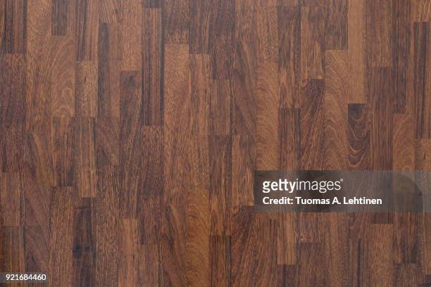 brown wood laminate flooring texture background in house. - houten vloer stockfoto's en -beelden