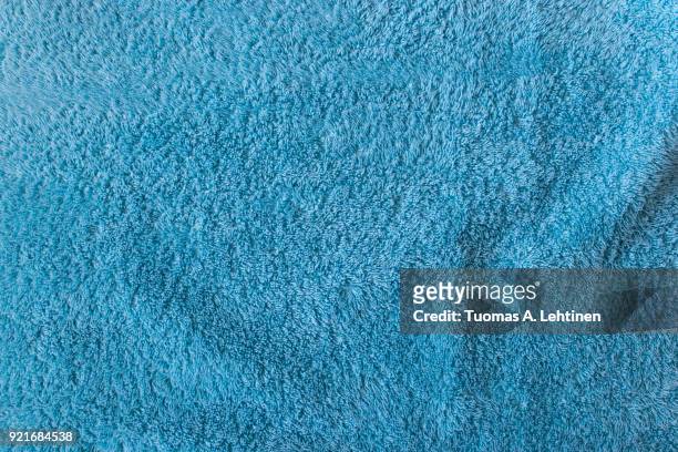 close-up of soft turquoise towel texture background viewed from above. - towel stock pictures, royalty-free photos & images