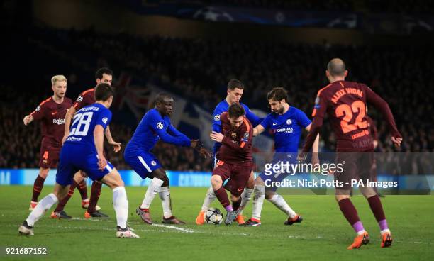 Chelsea players surround Barcelona's Lionel Messi during the UEFA Champions League round of sixteen, first leg match at Stamford Bridge, London.