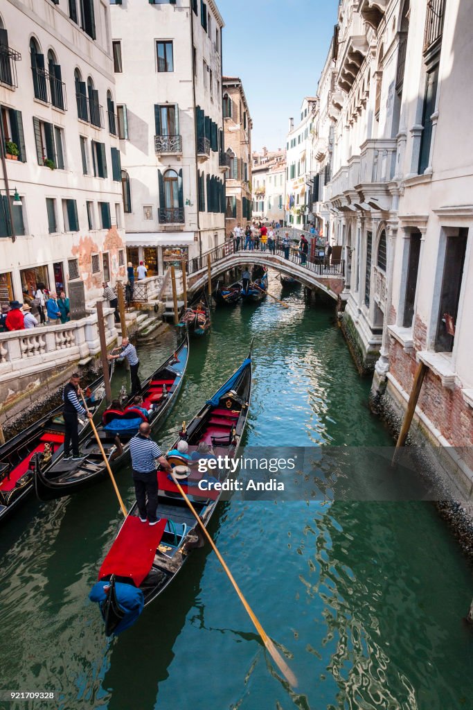 Gondoliers in the district of St. Mark.