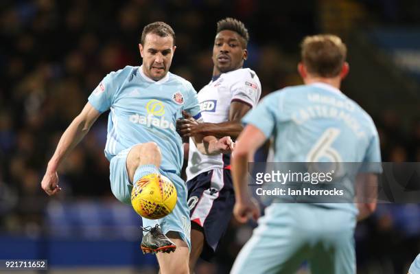 John O'Shea of Sunderland is challenged by Sammy Ameobi during the Sky Bet Championship match between Bolton Wanderers and Sunderland at Macron...
