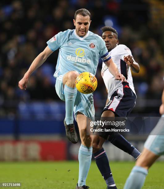 John O'Shea of Sunderland is challenged by Sammy Ameobi during the Sky Bet Championship match between Bolton Wanderers and Sunderland at Macron...