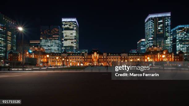 illuminated tokyo station in marunouchi commercial district at night, japan - tokyo station stock pictures, royalty-free photos & images