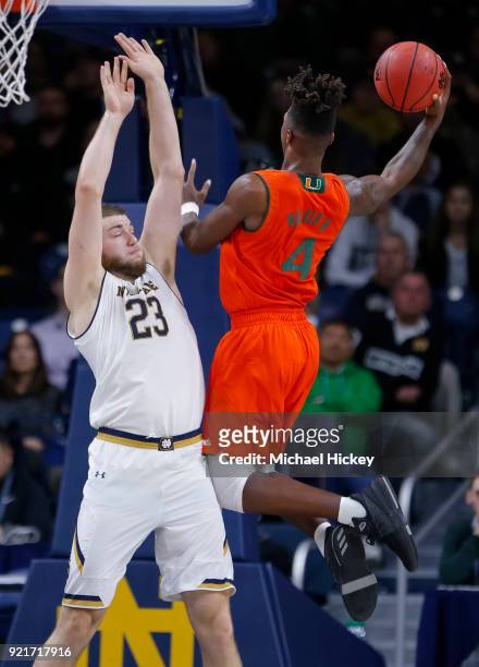 Lonnie Walker IV of the Miami Hurricanes shoots the ball against Martinas Geben of the Notre Dame Fighting Irish at Purcell Pavilion on February 19,...
