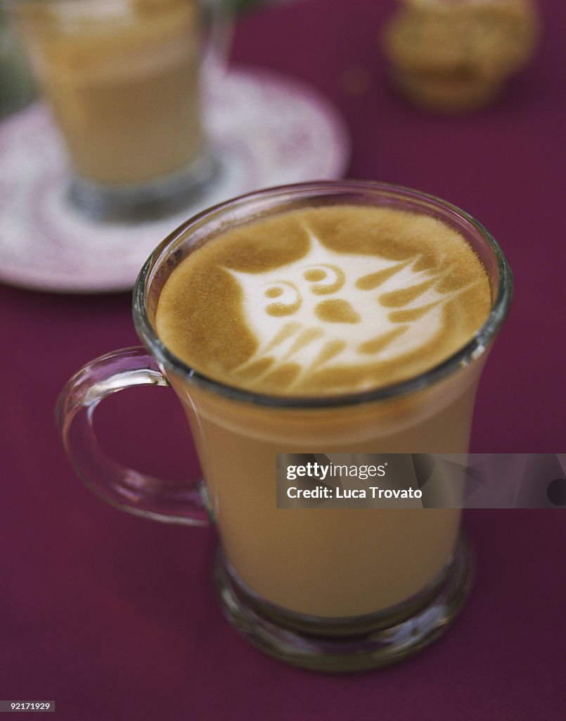 Cafe latte with cat face in foam