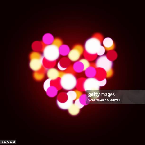 bokeh heart - glowing heart stock pictures, royalty-free photos & images