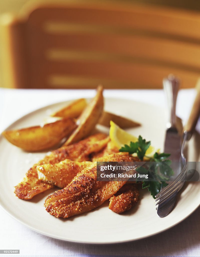Spicy lemon sole with potato wedges