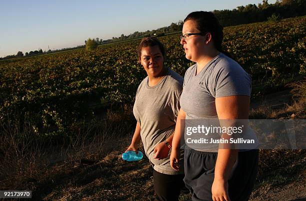 Seventeen year-old Marissa Hamilton walks with her friend Elizabeth Fedorchalk during a morning walk at Wellspring Academy October 19, 2009 in...