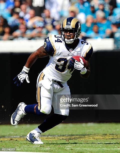 Kenneth Darby of the St. Louis Rams runs for yardage during the game against the Jacksonville Jaguars at Jacksonville Municipal Stadium on October...