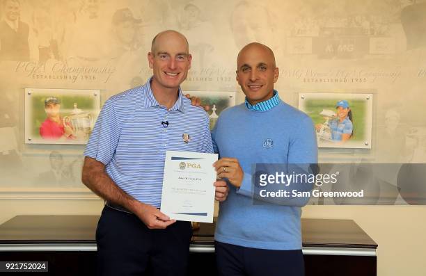 Jim Furyk of the United States receives a 25 Year PGA Participation Award from CEO of the PGA of America, Pete Bevacqua prior to The Honda Classic at...