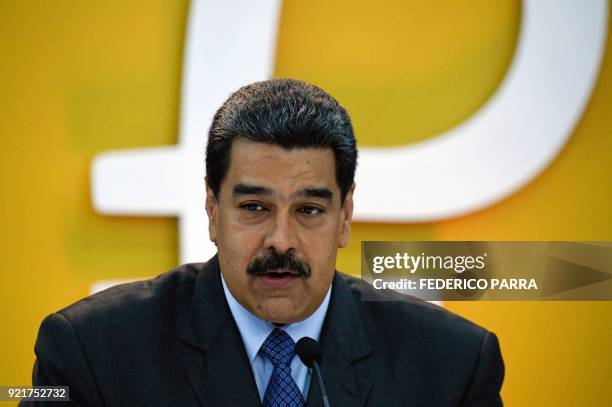 Venezuela's President Nicolas Maduro delivers a speach during a press conference to launch to the market a new oil-backed cryptocurrency called...