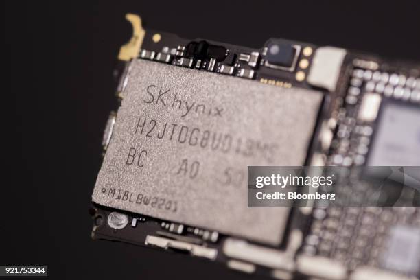 An SK Hynix Inc. NAND flash memory chip of an Apple Inc. IPhone 6 smartphone is seen in an arranged photograph in Bangkok, Thailand, on Saturday,...