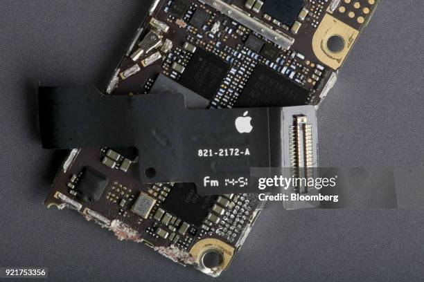 Sensor cable sits on the logic board of an Apple Inc. IPhone 6 smartphone in an arranged photograph in Bangkok, Thailand, on Saturday, Feb. 3, 2018....