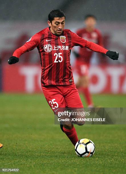 Shanghai SIPG midfielder Odil Akhmedov of Uzbekistan controls the ball during the AFC Asian Champions League group F football match between the...