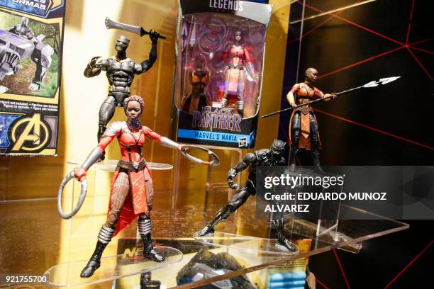 Black Panther toys are displayed to attendees at the Hasbro showroom during the annual New York Toy Fair, on February 20 in New York. Panther claws,...