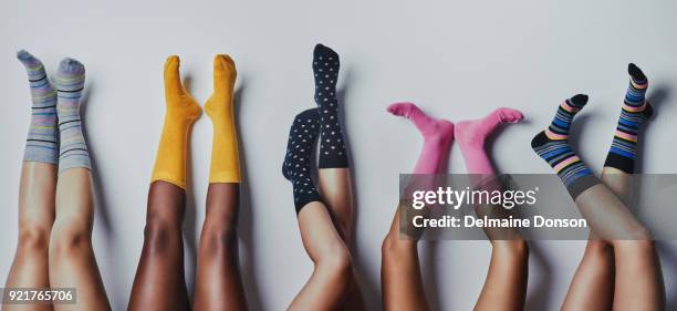 these socks makes us feel fun and funky - feet in socks stock pictures, royalty-free photos & images