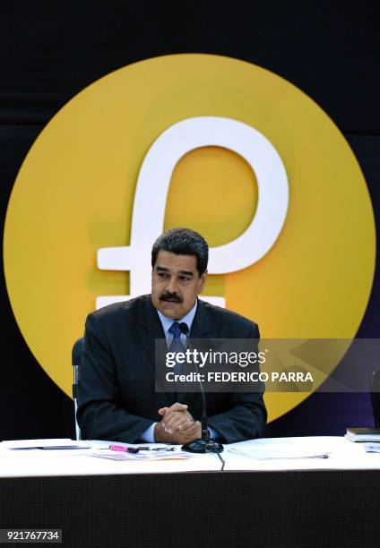 Venezuela's President Nicolas Maduro delivers a speech during a press conference to launch to the market a new oil-backed cryptocurrency called...