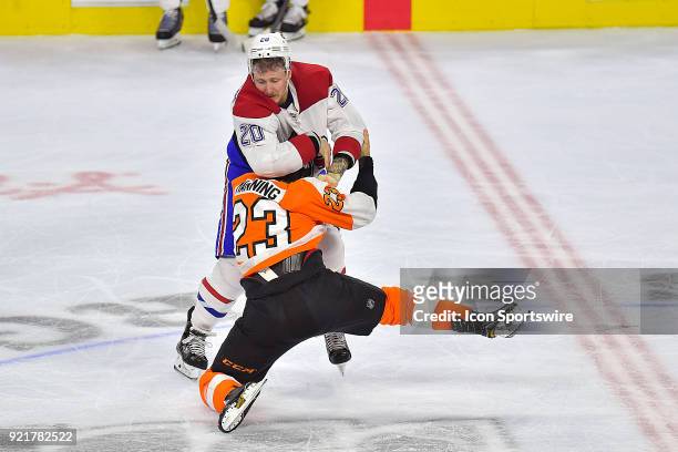 Montreal Canadiens left wing Nicolas Deslauriers takes down Philadelphia Flyers defenseman Brandon Manning with fists during the NHL game between the...