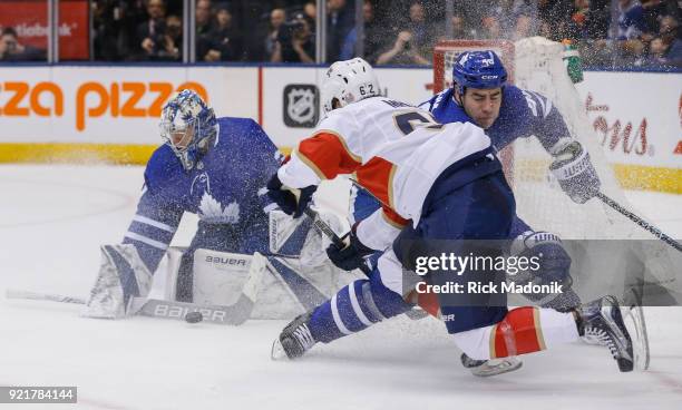 Toronto Maple Leafs defenseman Roman Polak also plays catch up as Florida Panthers center Denis Malgin gets loose and manages a backhander on Toronto...