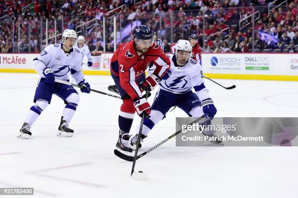 Matt Niskanen of the Washington Capitals battles for the puck against Tyler Johnson of the Tampa Bay Lightning in the first period at Capital One...