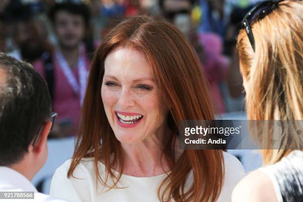 Salerno. 47th edition of the Giffoni Experience Film Festival. Portrait of American actress Julianne Moore, wearing a white dress. Talking with fans.