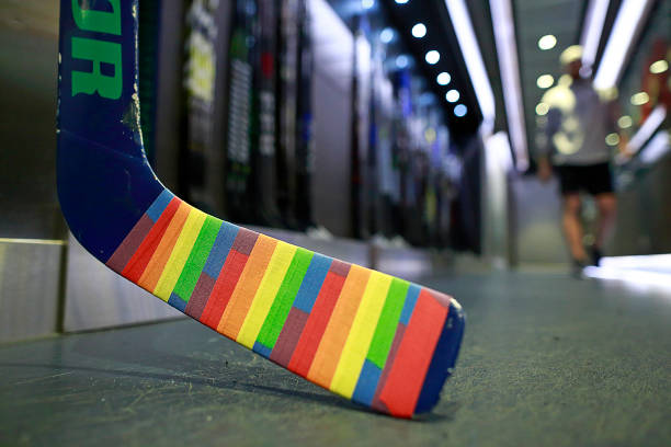 The goal stick of Anders Nilsson of the Vancouver Canucks is covered in Pride tape as it sits in the Canucks dressing room before their NHL game...