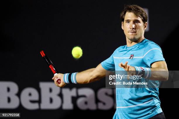 Dusan Lajovic of Serbia returns a shot to Dominic Thiem of Austria during the ATP Rio Open 2018 at Jockey Club Brasileiro on February 20, 2018 in Rio...