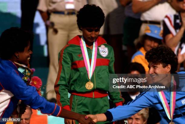 Los Angeles, CA Judi Brown, Nawal El Moutawakel, Cristieana Cojocaru, Women's Track 400 metres hurdles medal ceremony, Memorial Coliseum, at the 1984...