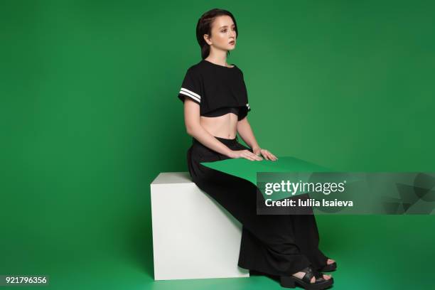 young stylish girl with paper in studio - blank expression stock pictures, royalty-free photos & images